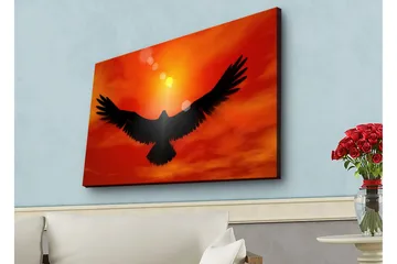 Canvastavla med LED-belysning - Silhuett av en örn som flyger mot en solnedgång i starka färger - Röd / Svart / Orange - Inredning - Tavlor & posters - Canvastavla