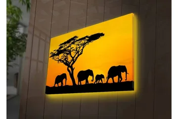 Canvastavla med LED-belysning - Silhuetter av elefanter under en solnedgång med ett träd i bakgrunden - Svart / Orange / Gul - Inredning - Tavlor & posters - Canvastavla