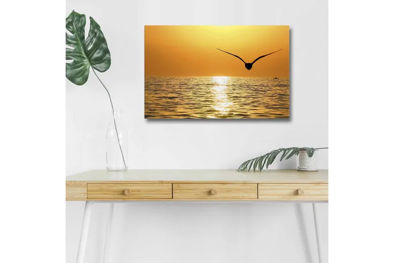 Canvastavla med LED-belysning - Solnedgång över havet med en fågel i flykt, Guld / Orange / Svart
