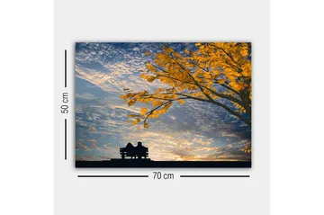 Canvastavla - Silhuett av ett par som sitter på en bänk under ett träd med gyllene höstlöv - Guld / Blå / Svart - Inredning - Tavlor & posters - Canvastavla