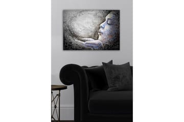 Canvastavla - Porträtt av en kvinna som blåser ut partiklar från sina händer - Grå / Blå / Svart - Inredning - Tavlor & posters - Canvastavla