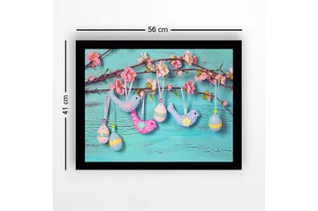 Inramad Canvastavla i trä - 41x56 cm - Färgglada påskdekorationer hängande på en gren med blommor - Ljusblå / Rosa / Gul - Inredning - Tavlor & posters - Canvastavla