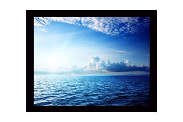 Inramad Canvastavla i trä - 41x56 cm - Storslagen havsutsikt med ljusa moln och strålar av sol - Blå / Ljusblå / Vit - Inredning - Tavlor & posters - Canvastavla