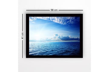 Inramad Canvastavla i trä - 41x56 cm - Storslagen havsutsikt med ljusa moln och strålar av sol - Blå / Ljusblå / Vit - Inredning - Tavlor & posters - Canvastavla