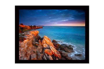 Inramad Canvastavla i trä - 41x56 cm - Vacker kustlinje med klippor och hav i skymningsljus - Turkos / Orange / Grå - Inredning - Tavlor & posters - Canvastavla